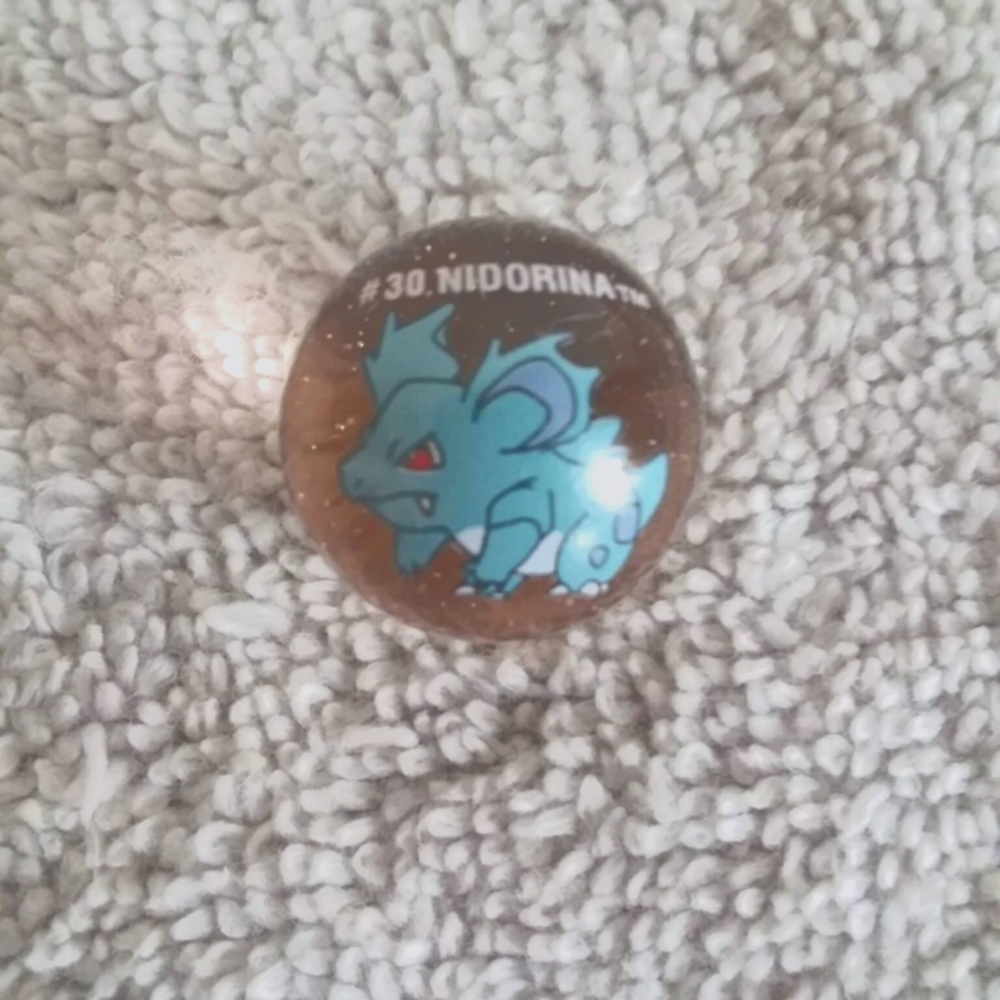 Pokemon marbles #30 Nidorina on light peach clear glass base shooter